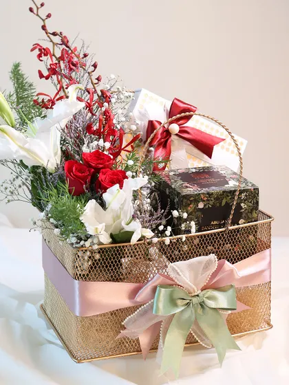 A side view of the Mother's Day basket, showing the elegant arrangement and the beautiful, multi-layered ribbon.