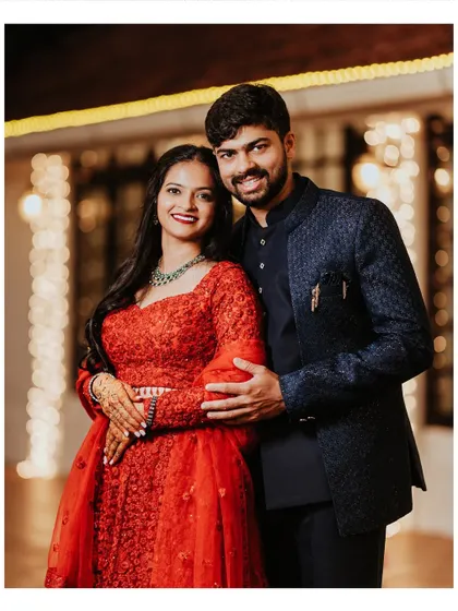 A classic reception portrait of the couple in their elegant evening wear, looking happy and in love.