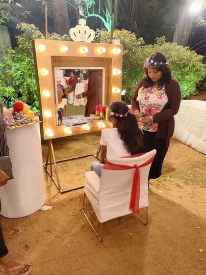 A princess pampering station with a lit-up vanity mirror, where little guests could get their hair styled.