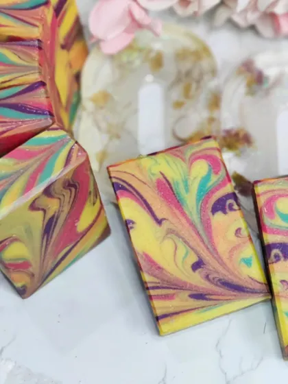 A vibrant collection of swirled soaps ready for The Good Market.