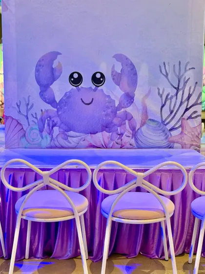 We set up dedicated activity stations for crayon making and tattoos, all themed with cute watercolor sea creatures to keep the little ones engaged and creative.