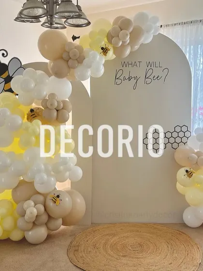 Gender reveals should be fun and unique, like this "What will Baby Bee?" theme. I use a clean, modern backdrop with custom text and a balloon arch in soft yellows and whites, accented with cute bee details for a playful touch.