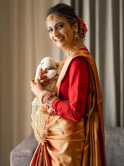 Another shot of the bride with her special keepsake, a moment of comfort and nostalgia on her wedding day.