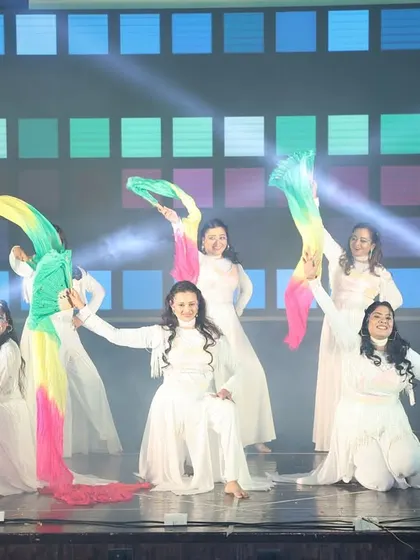 The ladies' batch uses colorful props to add a beautiful visual element to their "Aaja Nachle" dance.