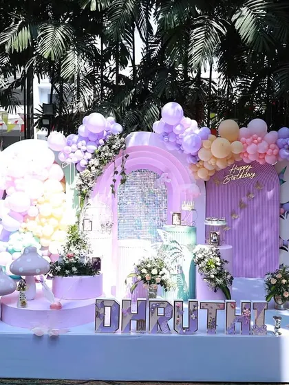 A spring butterfly theme is a timeless favorite for a reason. This beautiful setup for Dhruthi's party used a palette of soft pastels, floral accents, and enchanting butterfly wings to create a truly magical setting.