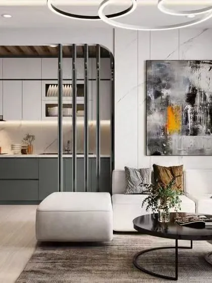 A wider view of the open-plan living area, showing how the L-shaped kitchen is integrated into the overall design of the home.
