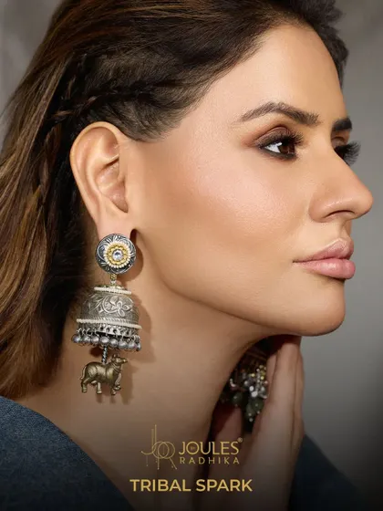 Not just an accessory, but a celebration of legacy. These tribal-inspired oxidized jhumkas feature an animal motif, adding a unique and powerful touch.