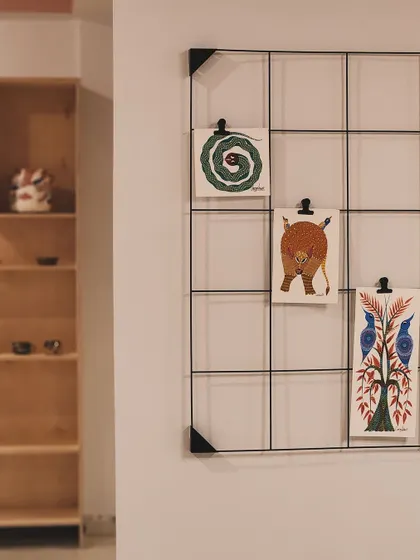 A corner of my studio, showing our inspiration board and shelves of finished pieces. It's a space designed to be warm, welcoming, and full of creative energy.