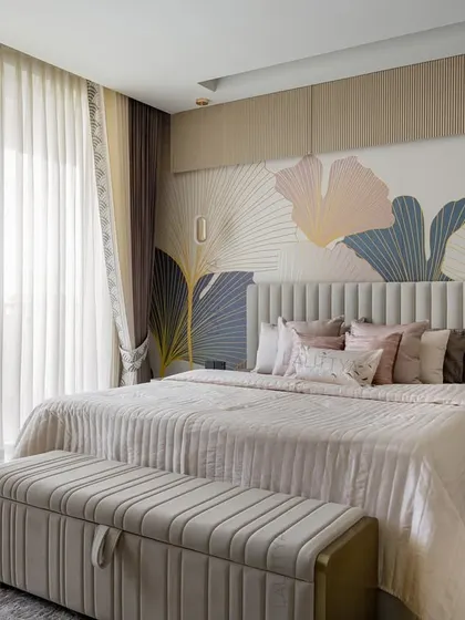 A beautifully appointed bedroom showcasing our signature style of quiet luxury. This space combines layered textures, a soothing color palette, and bespoke furniture to create a personal sanctuary for rest and relaxation.