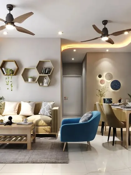 An open-plan living and dining area where a blue accent chair and hexagonal wall shelves add a playful touch to the otherwise neutral and warm wooden tones.