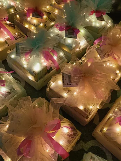 The warm and inviting glow of our lit-up Diwali hampers creates a truly festive atmosphere.
