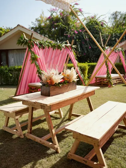 Cozy teepee-style seating arrangements for guests, adding a fun and informal element to this outdoor Mehendi celebration.