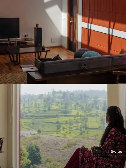 A quiet moment by the window, looking out over the rolling hills. The large picture window turns the landscape into a living piece of art, a core feature of the home's design.