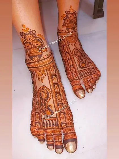 A traditional bridal foot design featuring a large peacock and kalash motifs. The pattern is dense and covers the foot beautifully, perfect for wedding ceremonies.