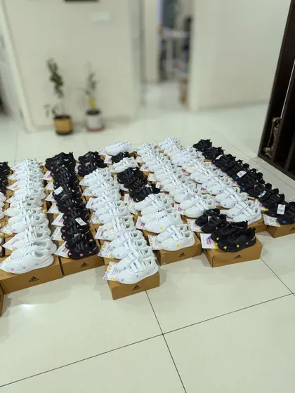 The calm before the storm. All 70 pairs of Adidas sneakers, ready to be customized. It was a huge undertaking, but I had help from my family.