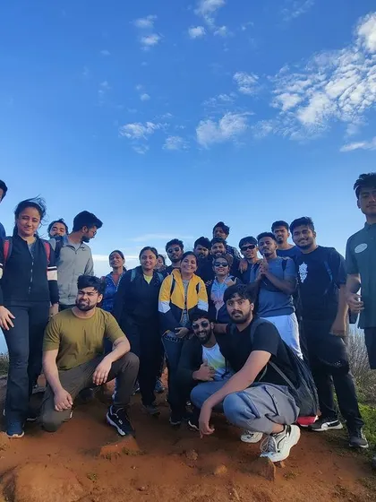 The full group at the top of Skandagiri, with the clear blue sky as our backdrop. A successful sunrise trek.