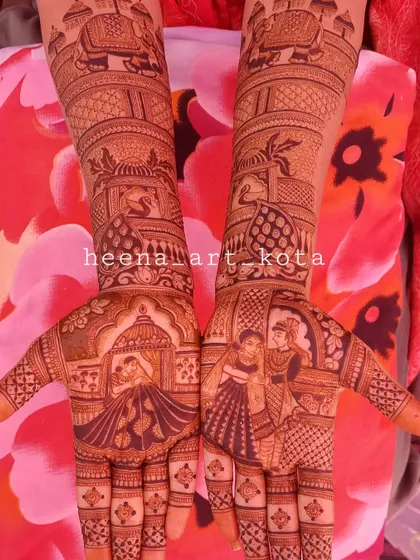 A classic bridal design with portraits of the couple on the palms and royal elephants on the arms.