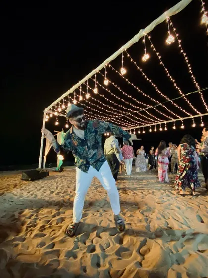 Caught in the middle of a move during a beachside sangeet party. Whether it's a ballroom or the sand, I bring the same high-energy choreography and fun to every wedding celebration.