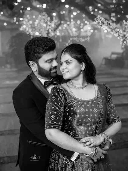 A timeless black and white portrait, capturing the intimate gaze between the couple.