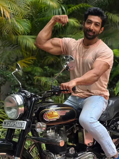 Made like a gun, goes like a bullet. Posing with a classic Royal Enfield.