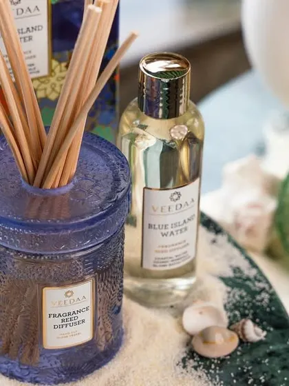 Elevate your senses with our essential oil reed diffusers. This Blue Island Water diffuser, set against a beachy backdrop, will transform your home into a haven of relaxation and peace.