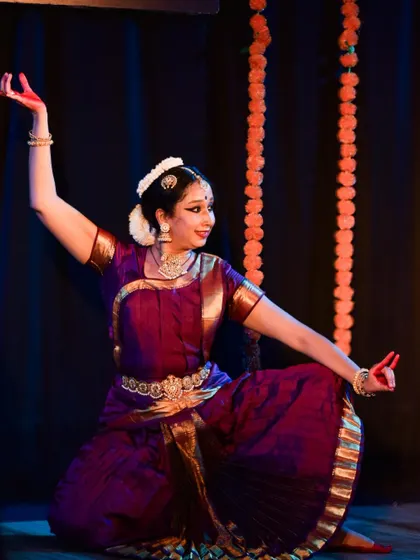A graceful pose showcasing the dancer's flexibility and control.
