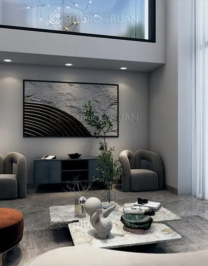 A double-height seating area in the Pitampura lobby, which creates a sense of spaciousness and allows for large windows and abundant natural light.
