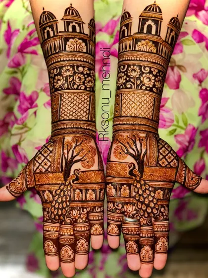 A stunning full-arm bridal design featuring a tree of life with a peacock, topped with majestic palace domes. This design tells a story of growth, beauty, and royalty.