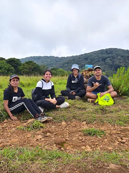 Taking a well-deserved rest on the trail during the Kudremukha trek. The vast grasslands offer plenty of spots to sit and soak in the views.
