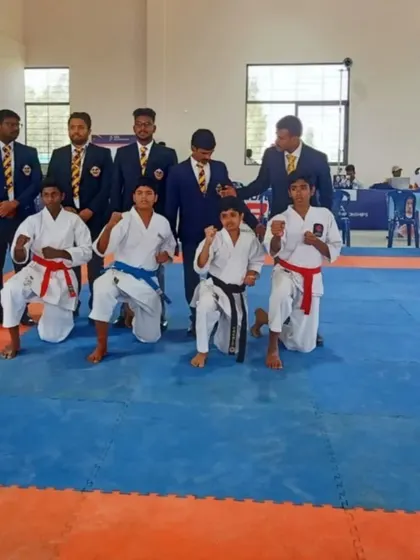 A group of my young competitors posing for a photo at the SFA Championship, demonstrating their strong karate spirit.