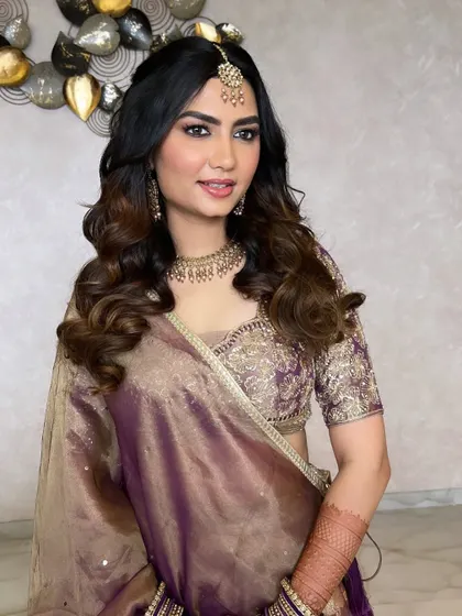 A full smile from this gorgeous bride-to-be at her engagement. The makeup is soft and glamorous, with an emphasis on glowing skin and beautifully defined eyes.
