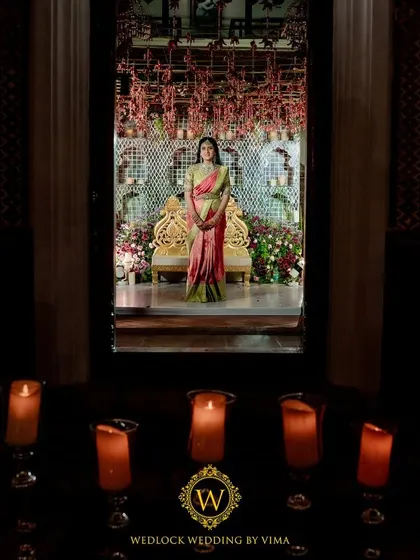 For this Varapuja ceremony, we used a vibrant palette of reds and pinks. The decor included hanging elephant charms and a mirrored backdrop to create a festive and prosperous atmosphere.