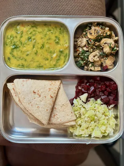 Another look at the colorful and nutritious plate of chapati, dal palak, and a mix of sautéed cabbage and beetroot, with mushroom palya.