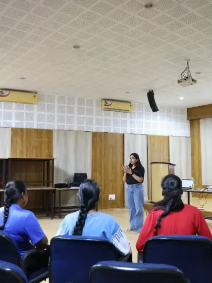 A wide view of a workshop session where our facilitator engages the entire group of young female athletes. The setup is designed for active participation, ensuring every athlete is part of the conversation about their future careers.