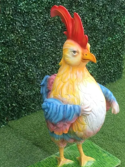 This colorful rooster prop stands tall and adds a vibrant splash of color to our farm animal set.