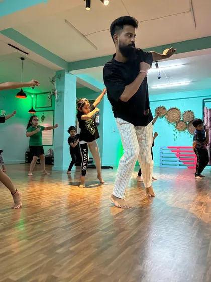 Our instructor, Anand, leading the Powerpuff Intermediate class. He brings incredible energy and precision to his teaching, inspiring the students to push themselves.