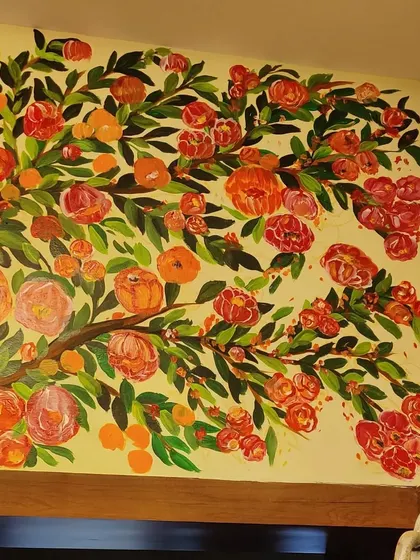 Another detail shot of the floral mural, showing the density of the flowers and the falling petals that add a sense of movement.