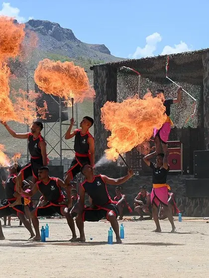 A dynamic fire-breathing performance by army personnel. Capturing action shots like this adds energy and excitement to the event gallery.
