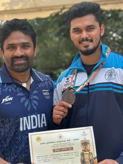 Posing with a fellow coach and my bronze medal. The boxing community in Karnataka is strong, and we are proud to be a part of it.