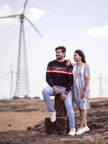 A casual pose against the unique backdrop of the windmills in Satara. It shows that any location can be romantic with the right person.