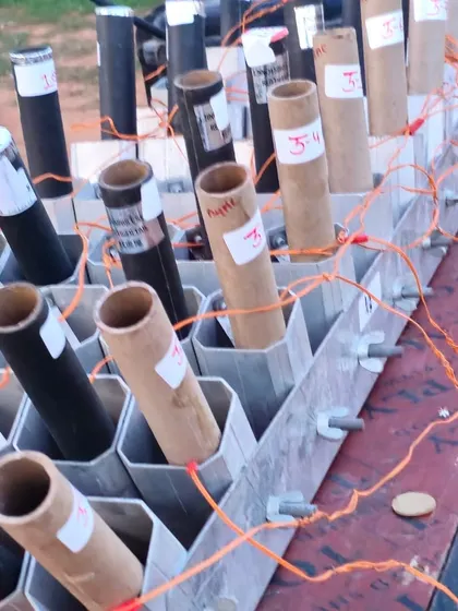 Another angle of the firework setup, showing the labeled tubes ready for a grand wedding celebration.