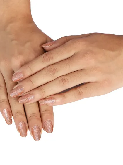 A model's hands showing the applied glitter nail polish. This on-model shot for e-commerce helps customers see the final look and color on a real person.