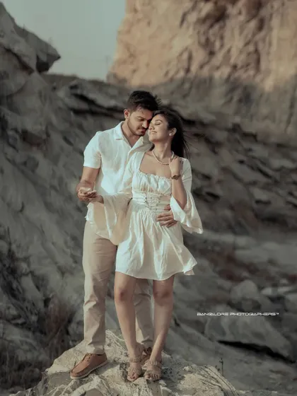 A duplicate of 23, this image captures a beautiful, intimate moment against a dramatic, rocky backdrop, perfect for an adventurous couple.