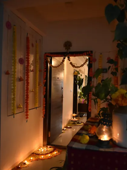 A night view of my Diwali entrance. The warm glow of the diyas and lanterns creates a very spiritual and inviting atmosphere.