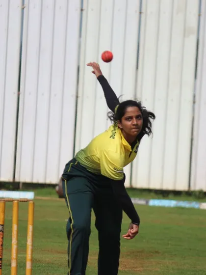 A bowler in mid-action during a women's cricket match. We capture dynamic moments that showcase the skill and athleticism of the players.