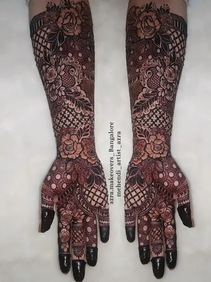 This design uses a reverse-fill technique with florals and net patterns for a bold and modern bridal look.
