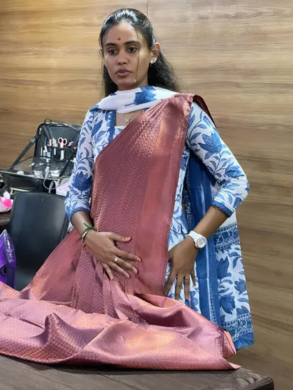 A trainer demonstrates saree draping techniques during our Bangalore masterclass.