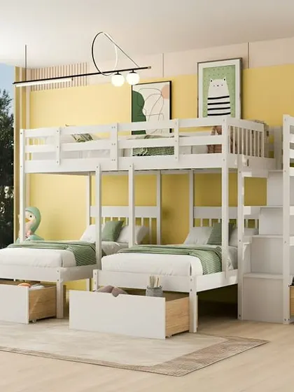 A quad bunk bed in white, a great solution for a vacation home or a room for four kids, with lots of built-in storage.