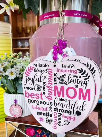 A heart-shaped wooden plaque for Mom, listing all the wonderful things she is. A perfect Mother's Day gift.