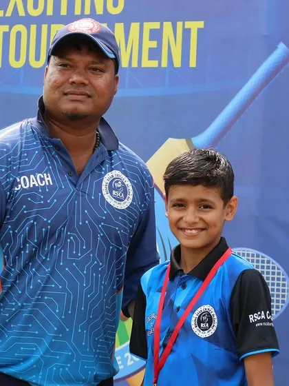 A proud coach with one of the young achievers of the RSCA Dasara Cup.